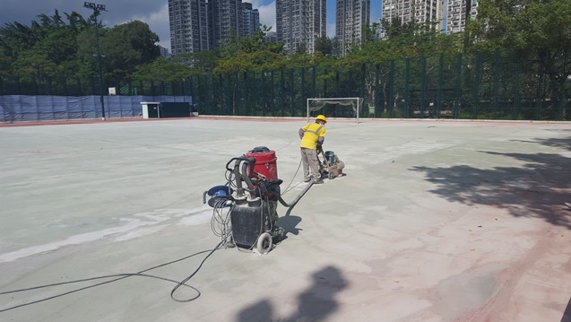 A concrete grinder at work